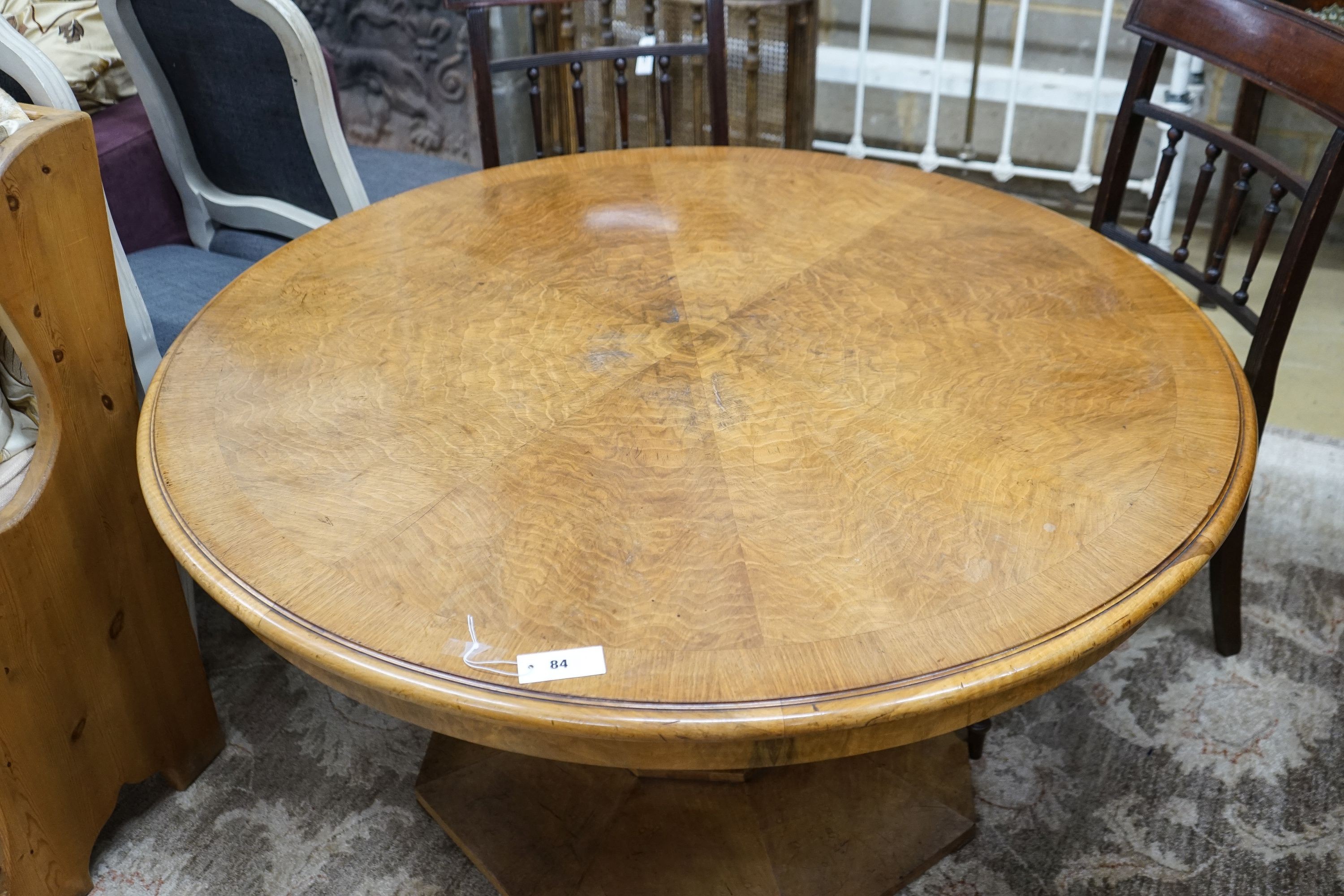 An Art Deco burr walnut circular low table with figured segmented veneered top, diameter 120cm, height 62cm
